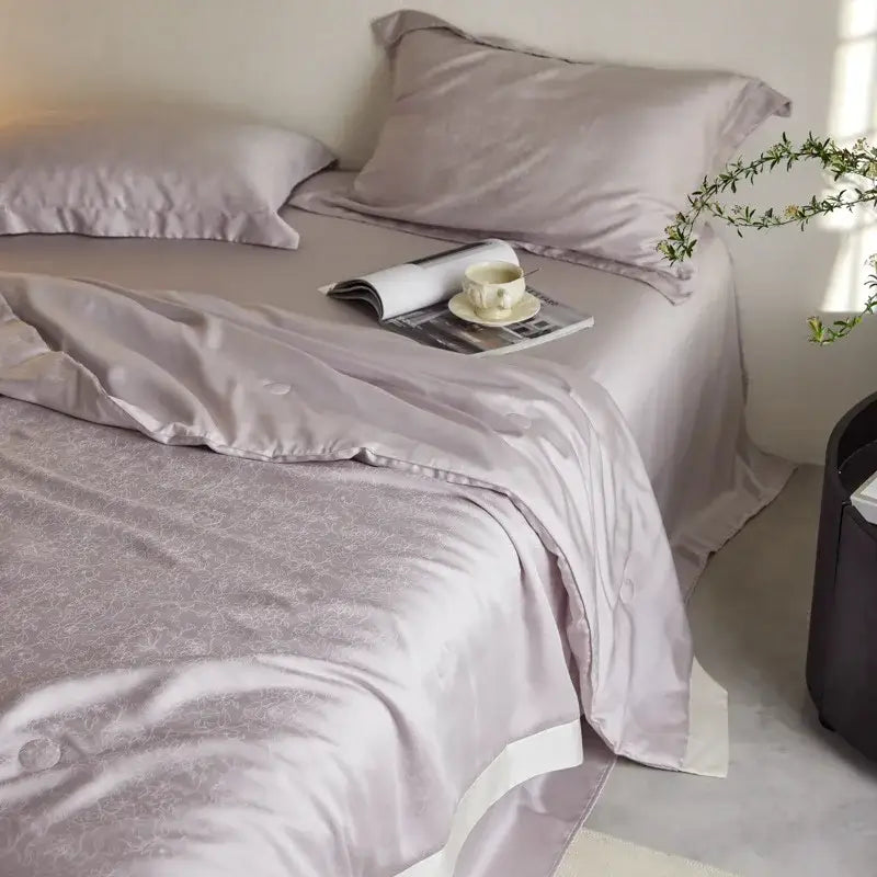Lavender jacquard quilt set with subtle floral embroidery and white piping for decorbites light luxury bedding