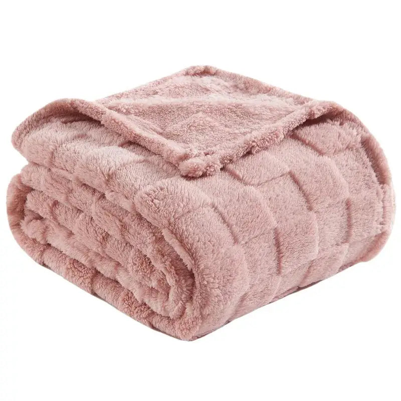 A plush dusty rose quilted cozy fluffy blanket with soft texture perfect for living room decorbites cozy use