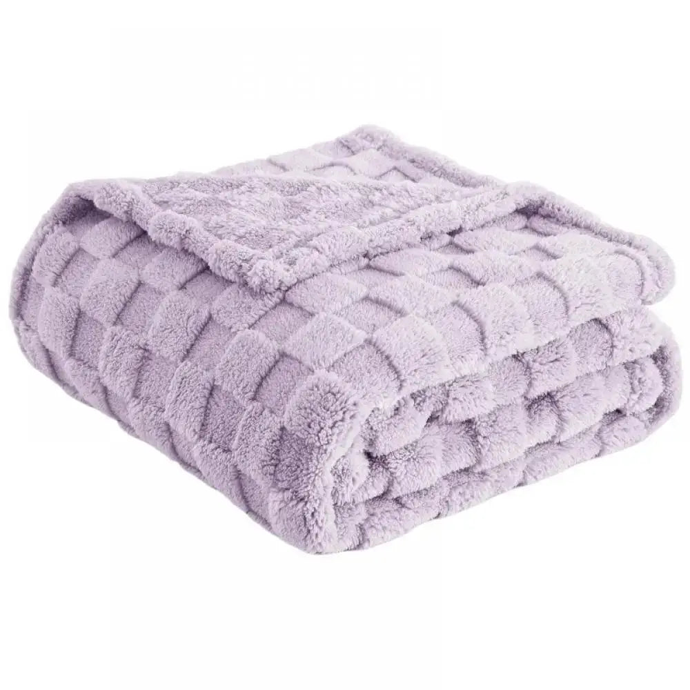 A lavender quilted plush cozy fluffy blanket with a textured diamond pattern perfect for living room decorbites cozy