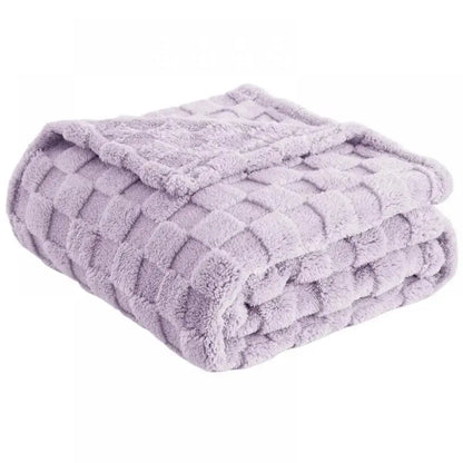 A lavender quilted plush cozy fluffy blanket with a textured diamond pattern perfect for living room decorbites cozy