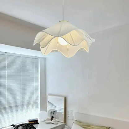 Layered white fabric pendant light with cream-colored petal-shaped shade and gold trim for dining room decorbites led white