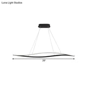 Modern black and white led island lamp with sleek curved design and black leaf frame in warm color temperature