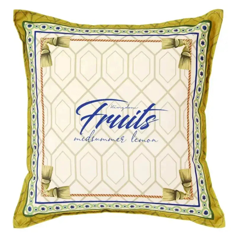 Square cream chenille cushion cover with lemon print and geometric pattern framed by mustard-yellow tassels decorbites lemon print