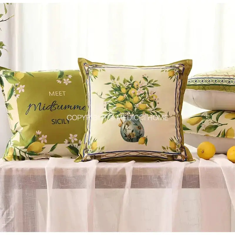 Cream-colored lemon print chenille cushion cover with detailed botanical design in blue vase and olive-green piping decorbites