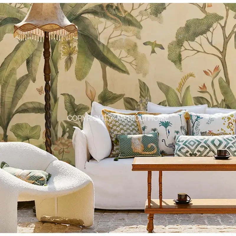 White upholstered sofa with green and yellow decorbites leopard decorative cushion covers and wooden coffee table