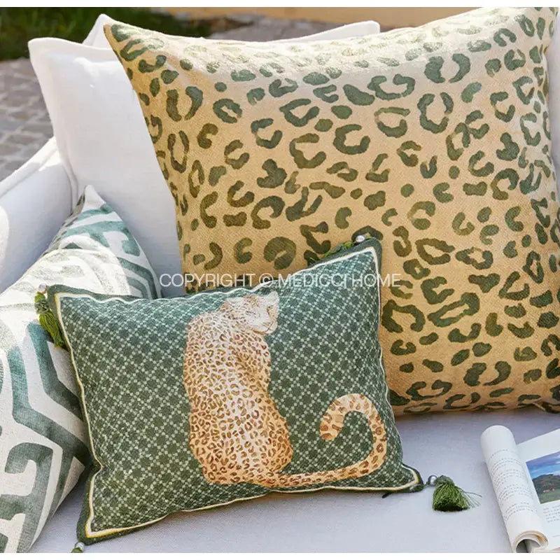 Green leopard decorative cushion cover featuring embroidered tan cheetah on dark green diamond pattern for living room decorbites