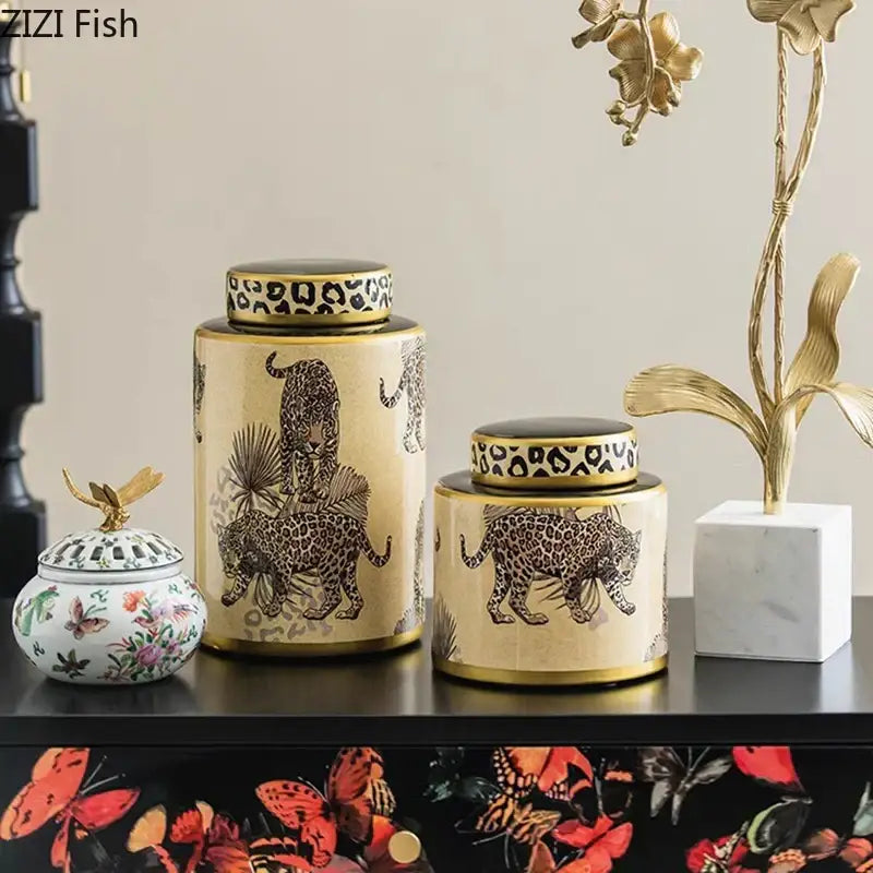 Cream-colored ceramic storage jar with gold trim and decorbites leopard pattern featuring a matching lid