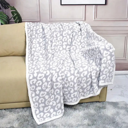 A plush gray and white leopard print cozy flannel velvet blanket with soft fuzzy texture for bedroom sofa decorbites cozy flannel