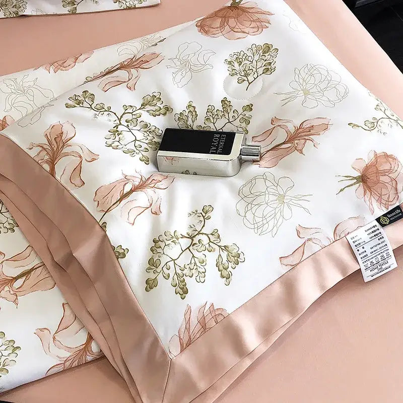 A silver perfume bottle with a black label on a white satin pillow sham with leopard print decorbites leopard print design