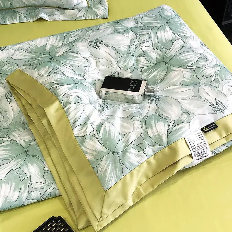 A light green satin duvet cover with white floral pattern and yellow border complementing decorbites leopard print pillow sham