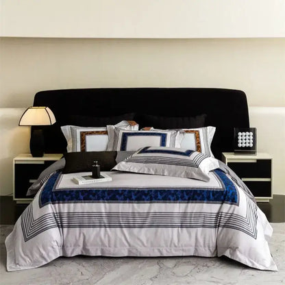 Luxury bedding set with sophisticated white base, bold navy geometric borders, and striped accents in decorbites 1000tc egyptian cotton