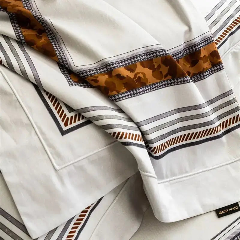 White satin pillowcase with bold black gray and brown geometric stripes and tan camouflage border in bedding set decorbites 1000tc egyptian cotton