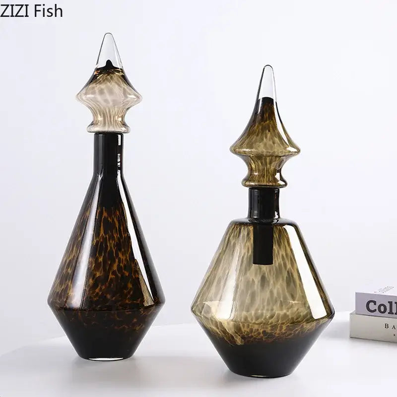 Two elegant amber and black leopard print glass decanters with intricate swirling patterns for decorbites leopard print decor