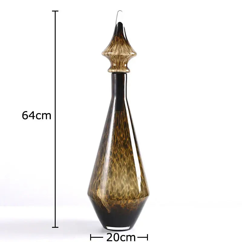 A tall 64cm amber and black leopard print glass decanter with a fluted stopper for living room decorbites decor