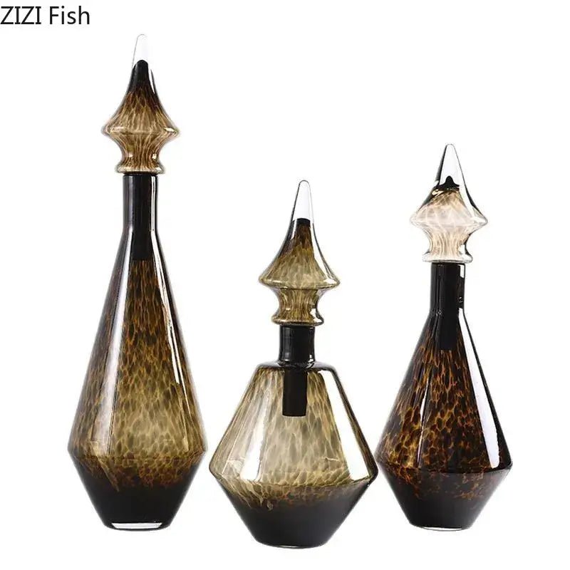 Set of three amber and black leopard print glass decanters with intricate textured patterns for living room decorbites decor