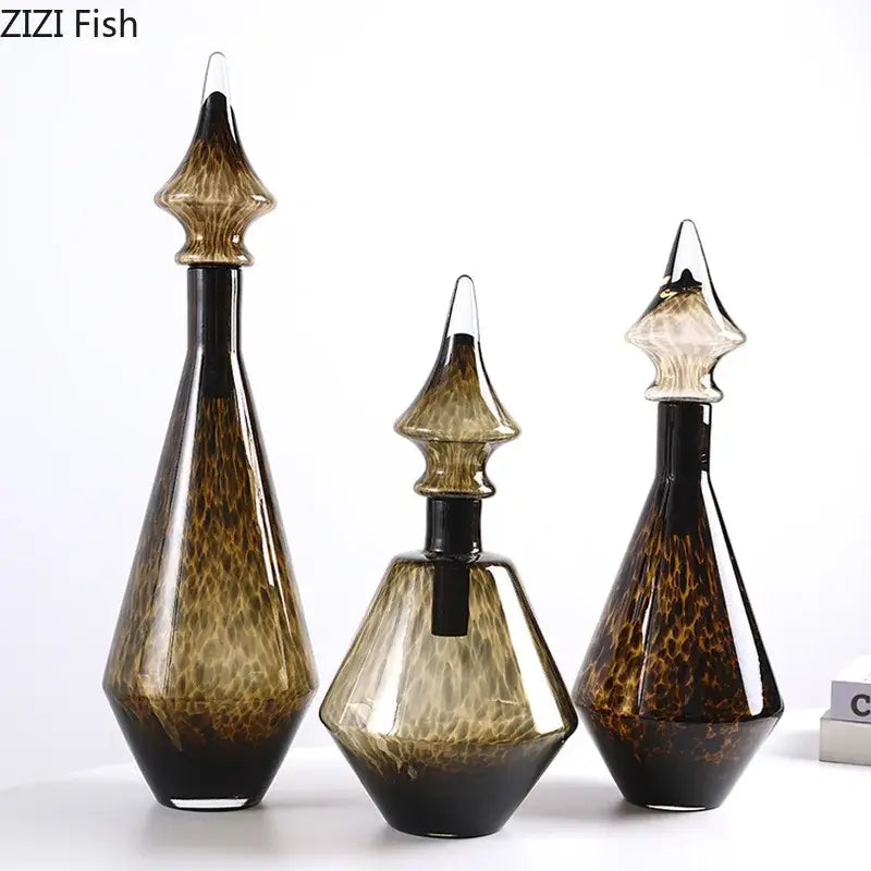 Set of three elegant amber and black leopard print glass decanters with crystal stoppers for living room decorbites decor