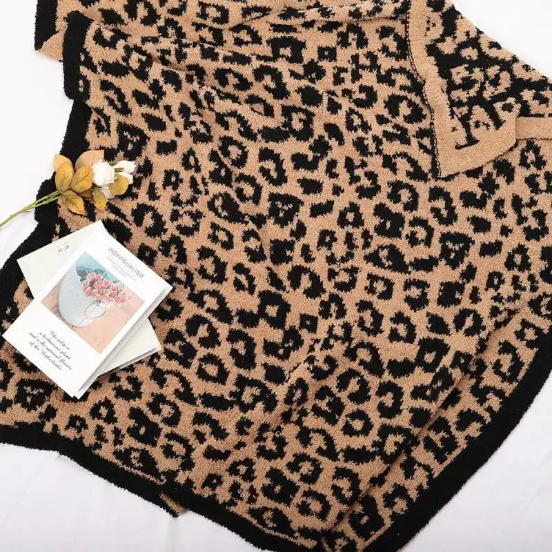 A cozy leopard print fleece blanket in tan and black knit fabric perfect for bedroom or sofa decorbites decor