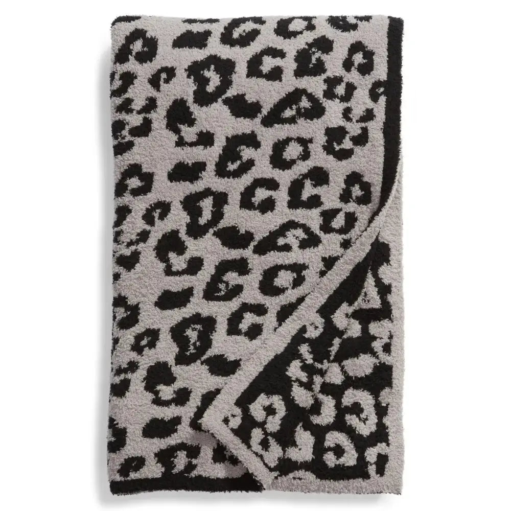 A plush gray and black leopard print fleece blanket with soft textured surface for bedroom sofa decorbites leopard print