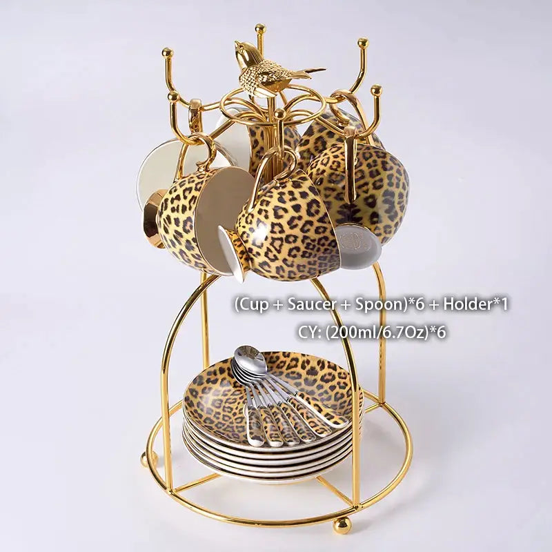 Gold-toned porcelain leopard print coffee set with matching spoons on tiered stand for decorbites leopard print decor
