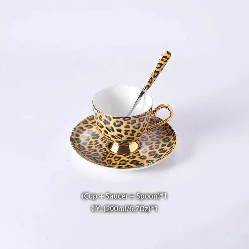 Elegant leopard print porcelain coffee set with gold accents including teacup, saucer, and matching spoon for decorbites decor