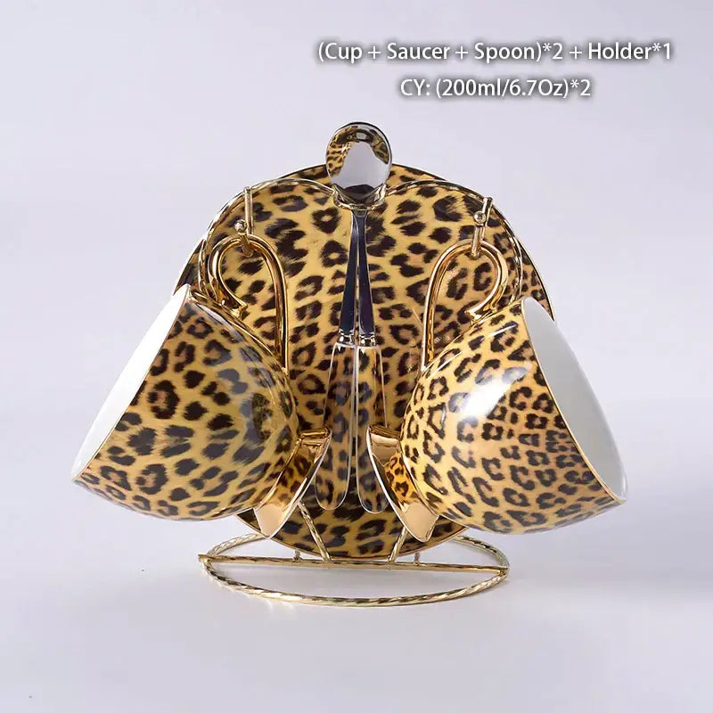 Gold-toned leopard print porcelain coffee set with matching saucers spoons on a gold metal holder decorbites leopard print