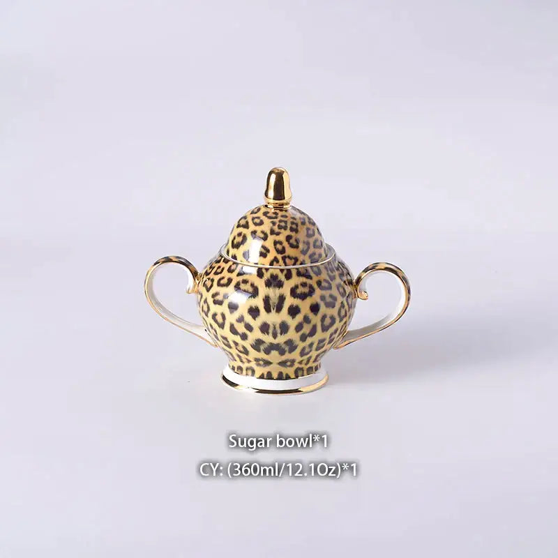 Leopard print ceramic sugar bowl with gold accents and handles from decorbites leopard print coffee set dining room decor