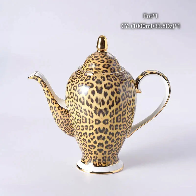A glossy ceramic teapot with bold leopard print and gold accents from the decorbites leopard print coffee set