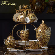 Leopard print porcelain coffee set with gold accents and matching stand for elegant decorbites leopard print decor