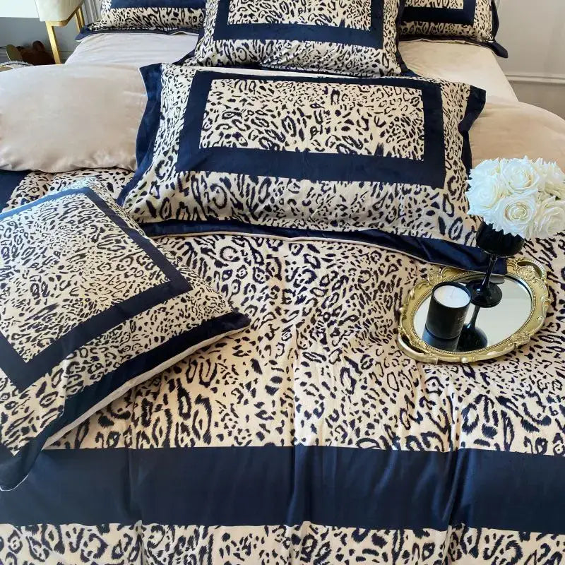 Cream-colored bedding set with bold black decorbites leopard print velvet and navy blue satin trim for bedroom decor