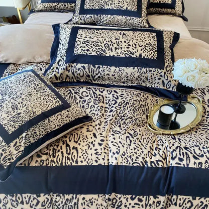 Cream-colored bedding set with bold black decorbites leopard print velvet and navy blue satin trim for bedroom decor