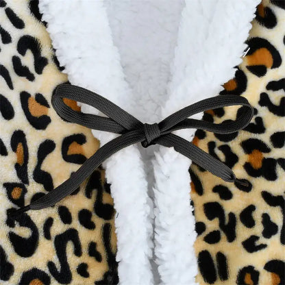 A cozy leopard print warm wearable fleece robe with white sherpa lining and black ribbon bow by decorbites