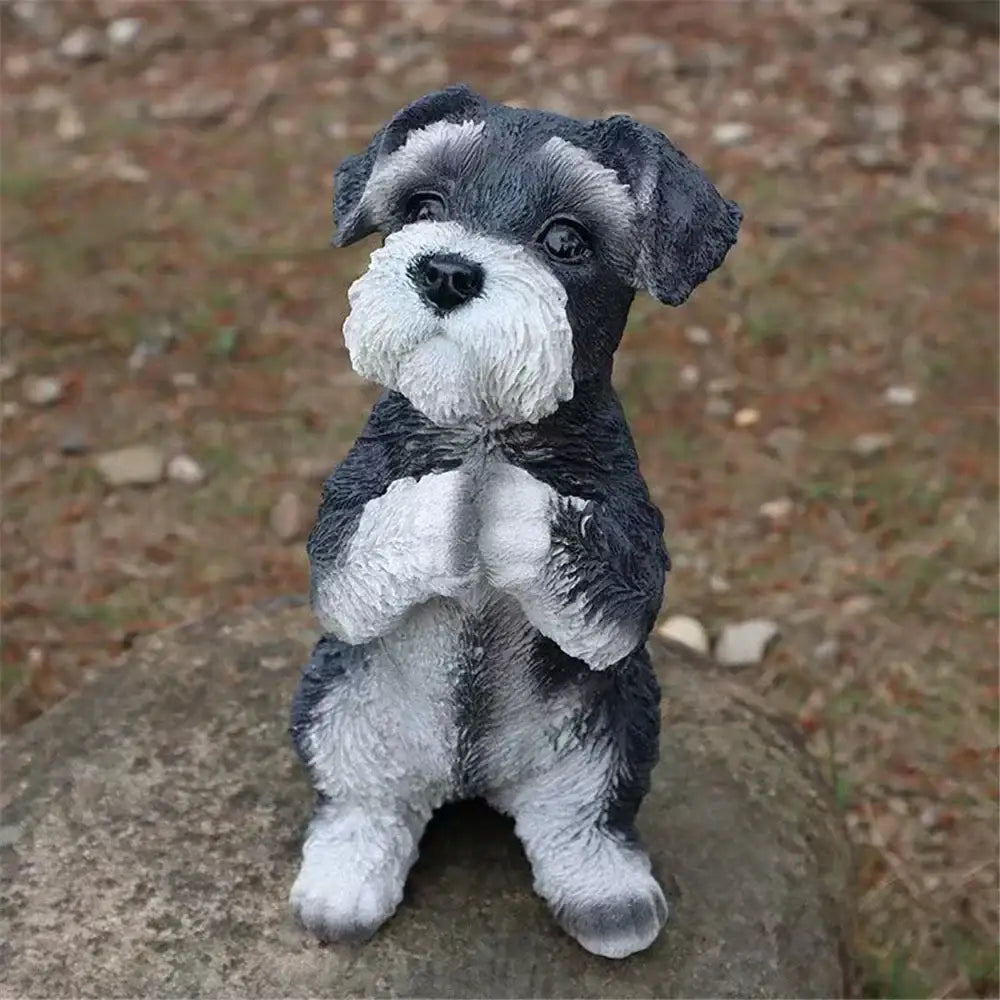Detailed black and white resin miniature schnauzer dog sculpture with textured fur sitting on rock by decorbites dog sculpture