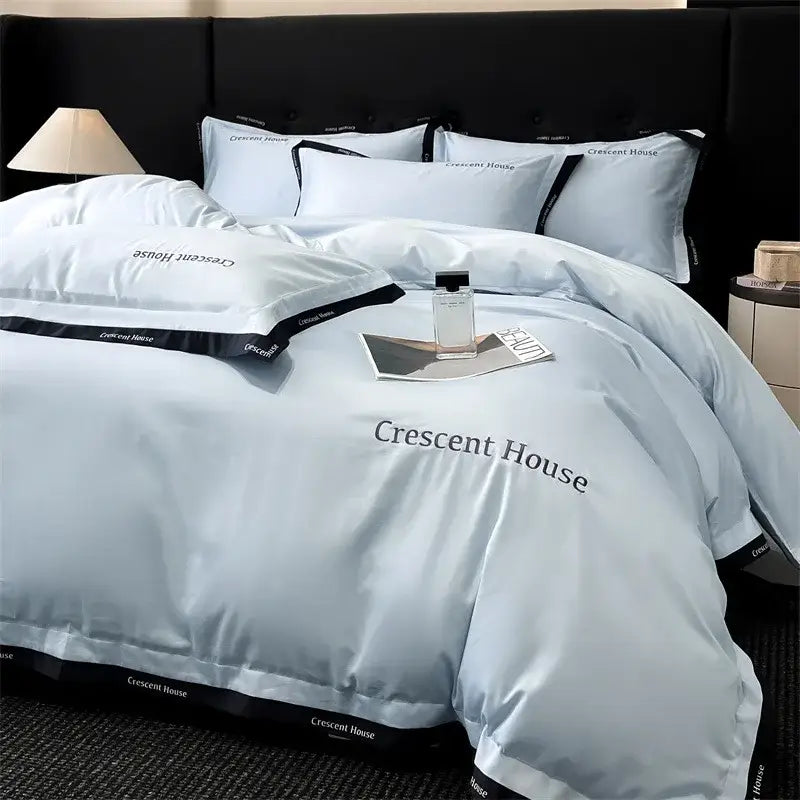 Light blue and black ice silk duvet cover bed set with crescent house branding by decorbites for bedroom decor