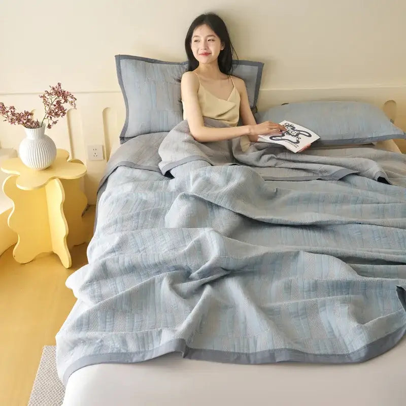 Light blue and gray decorbites cotton summer cool quilt towel blanket with textured striped pattern and matching pillowcases