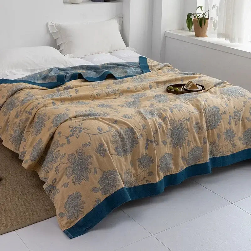 Beige floral-patterned quilt with teal border made of soft decorbites cotton gauze towel throw for bedroom decor