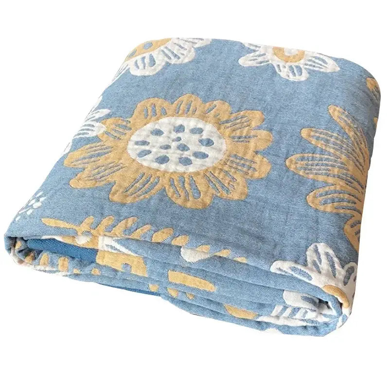 Soft blue cotton gauze towel throw with bold mustard yellow and white floral pattern for bedroom decorbites cotton gauze