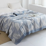 Light blue and white leaf cotton gauze towel throw with quilted pattern and solid blue border for bedroom decorbites cotton gauze