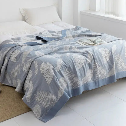 Light blue and white leaf cotton gauze towel throw with quilted pattern and solid blue border for bedroom decorbites cotton gauze