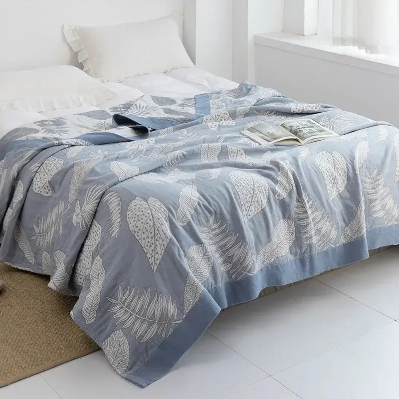 Light blue and white leaf cotton gauze towel throw with quilted pattern and solid blue border for bedroom decorbites cotton gauze