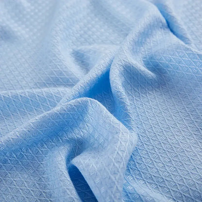 Light blue bamboo fiber summer quilt with subtle diamond grid texture for decorbites bamboo fiber bedding