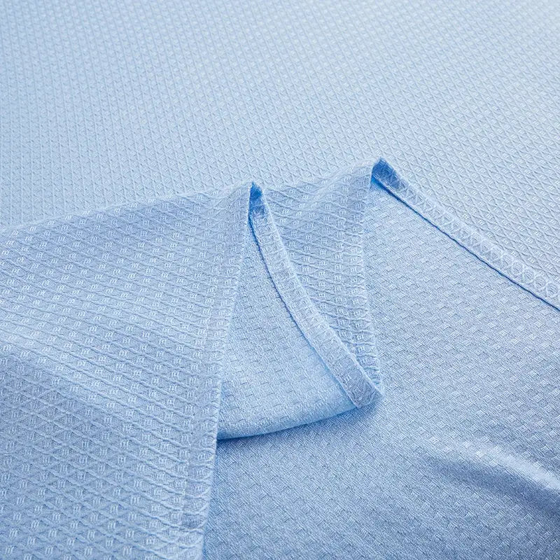 Light blue bamboo fiber summer quilt with a subtle woven pattern diamond grid design by decorbites bamboo fiber