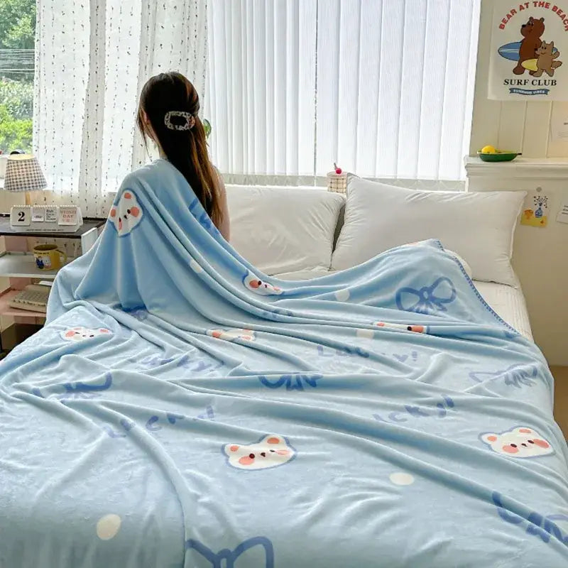 Light blue bear pattern cozy milk velvet blanket with embroidered white bear faces and navy blue bows for decorbites cozy milk