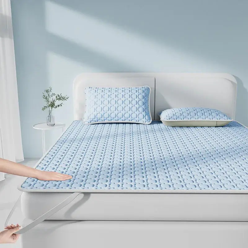 Light blue and beige decorbites cooling latex quilted mattress pad with raised dot pattern for bedroom use