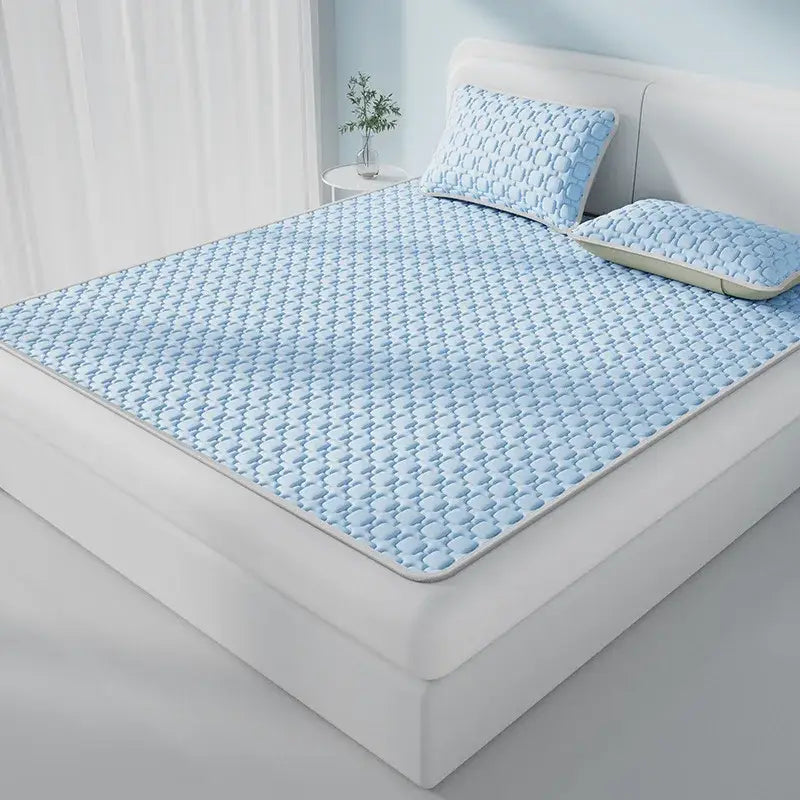 Light blue quilted decorbites cooling latex pad with soft padded texture and subtle geometric pattern for bedroom use