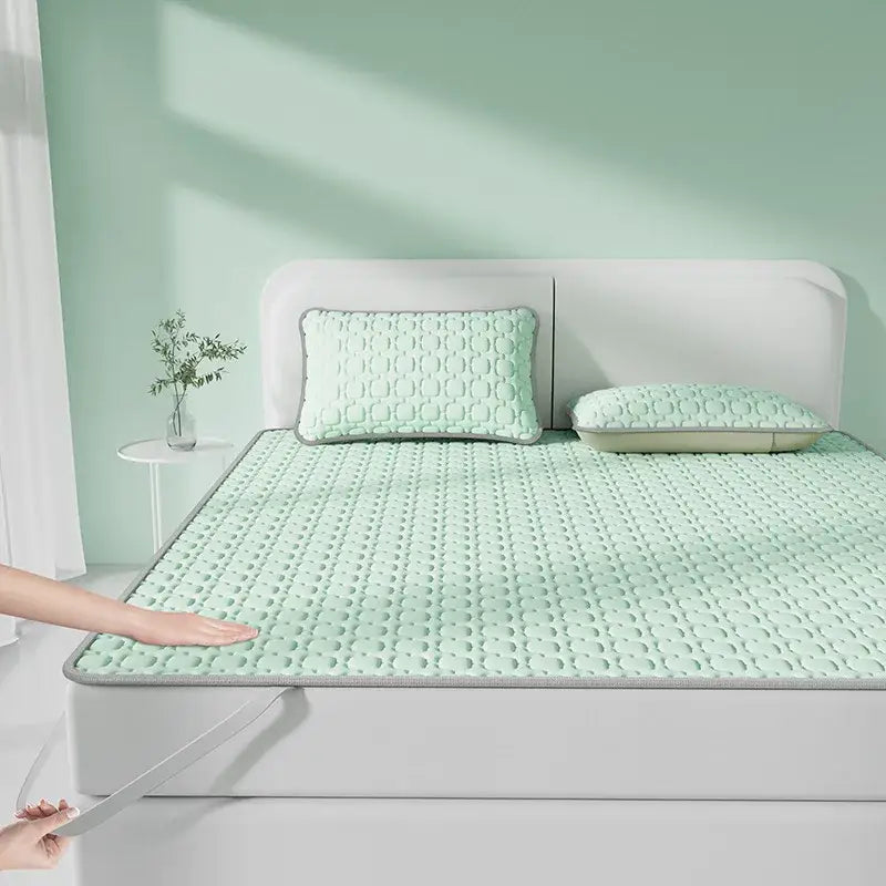 Mint green quilted cooling latex pad with raised dot pattern and gray trim for decorbites cooling comfort