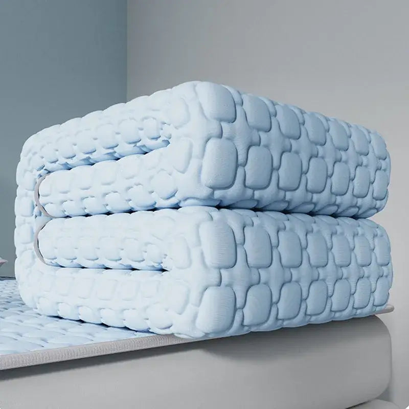 Light blue quilted mattress topper with soft texture and subtle stitching in decorbites cooling latex pad design