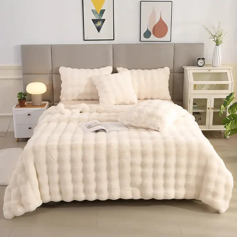 Cream-colored plush faux fur quilt with ribbed texture in light blue bubble rabbit velvet rabbit velvet blanket decorbites