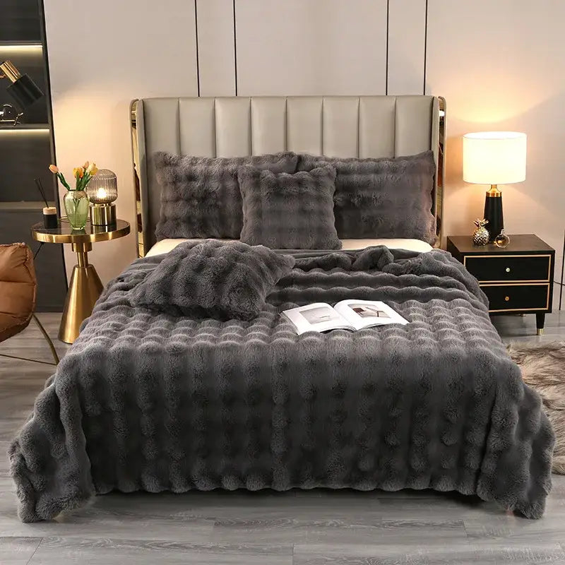 Plush dark gray faux fur quilt with textured bubbly surface and matching pillows from decorbites bubble rabbit velvet collection