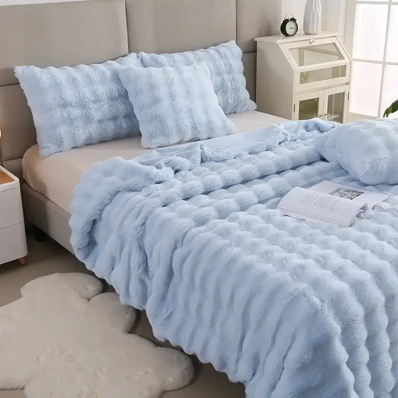 Light blue bubble rabbit velvet blanket with a plush textured throw and wavy raised decorbites bubble rabbit pattern