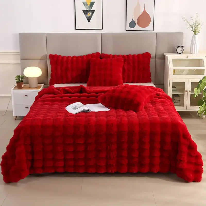 Vibrant red plush faux fur quilt with tufted design from decorbites bubble rabbit velvet blanket collection